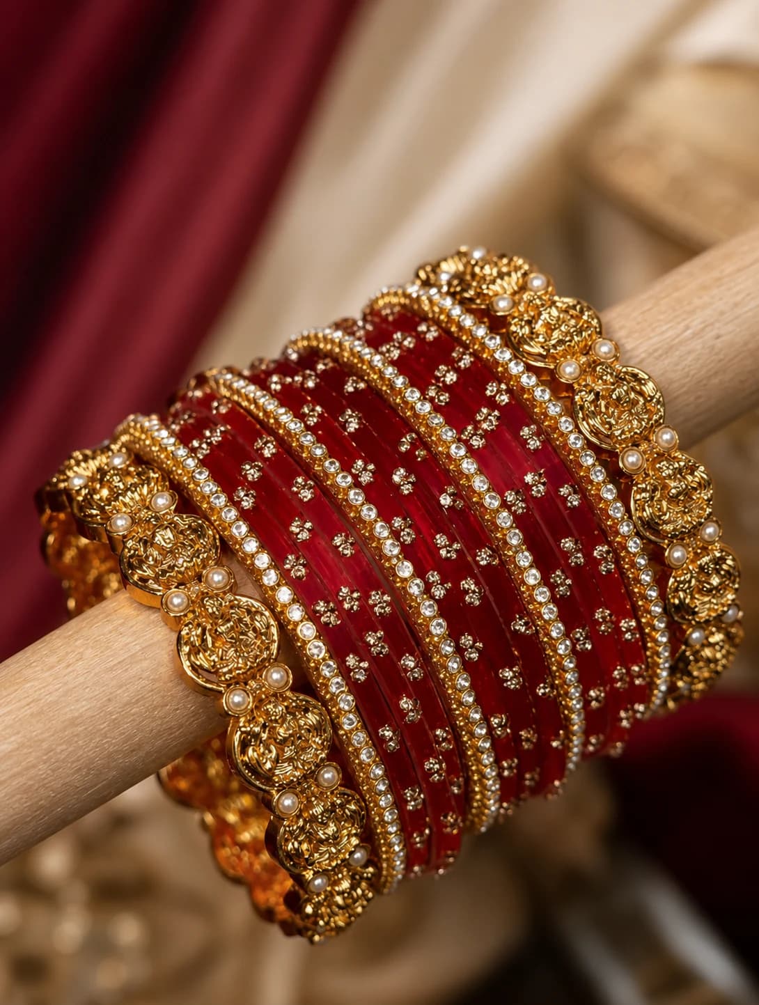 Crimson bridal bangle stack with crystal, pearl and warm-tone details