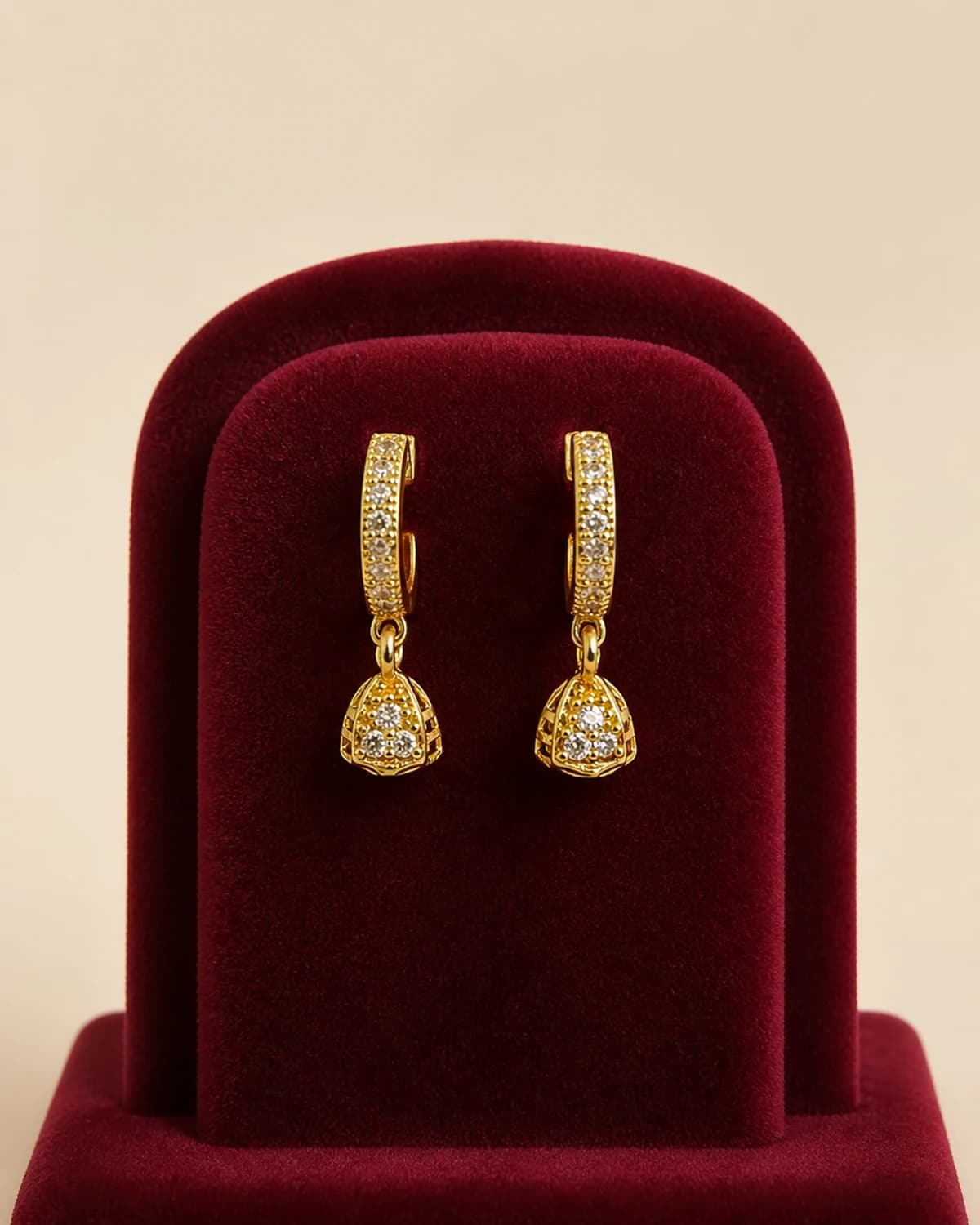 Small crystal-set hoop earrings with rounded bell drops