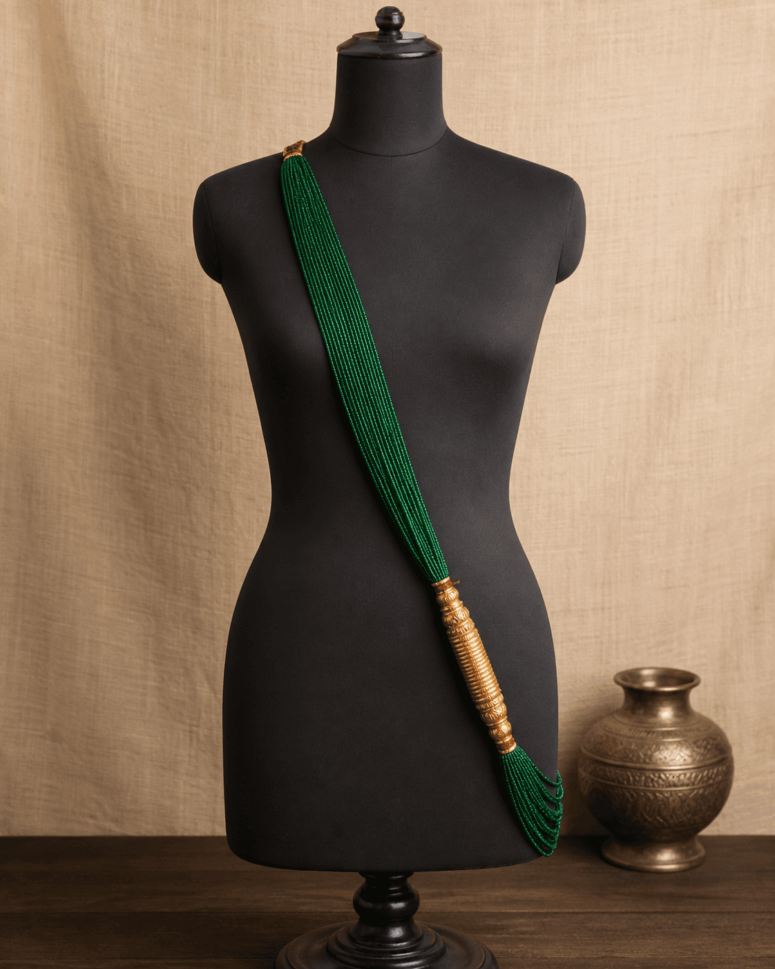 Long Chadke Tilhari worn diagonally with green potey strands and a gold-plated cylinder
