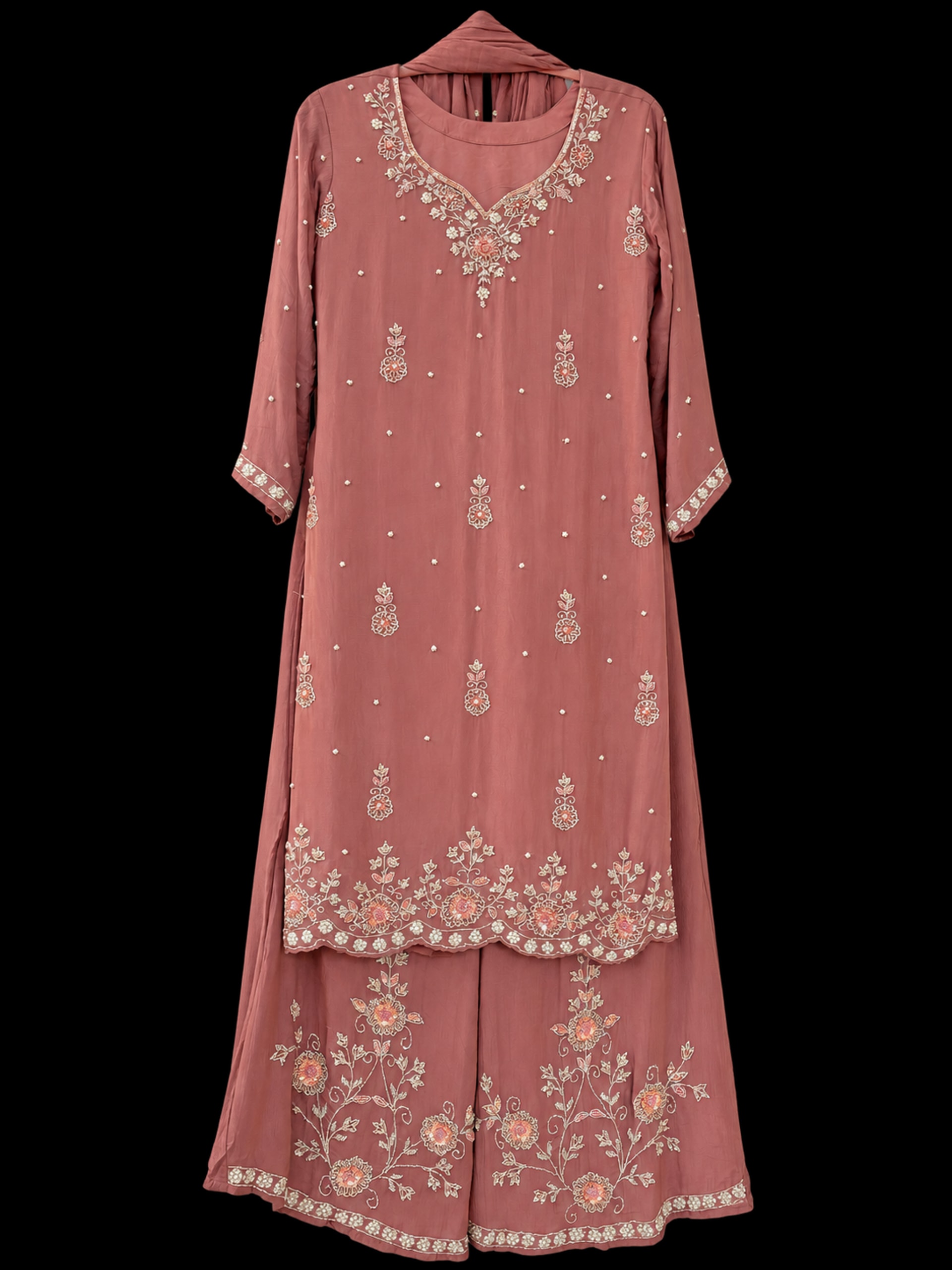 A dusty rose kurta suruwal with cream and peach floral embroidery, wide-leg trousers and a plain dupatta.