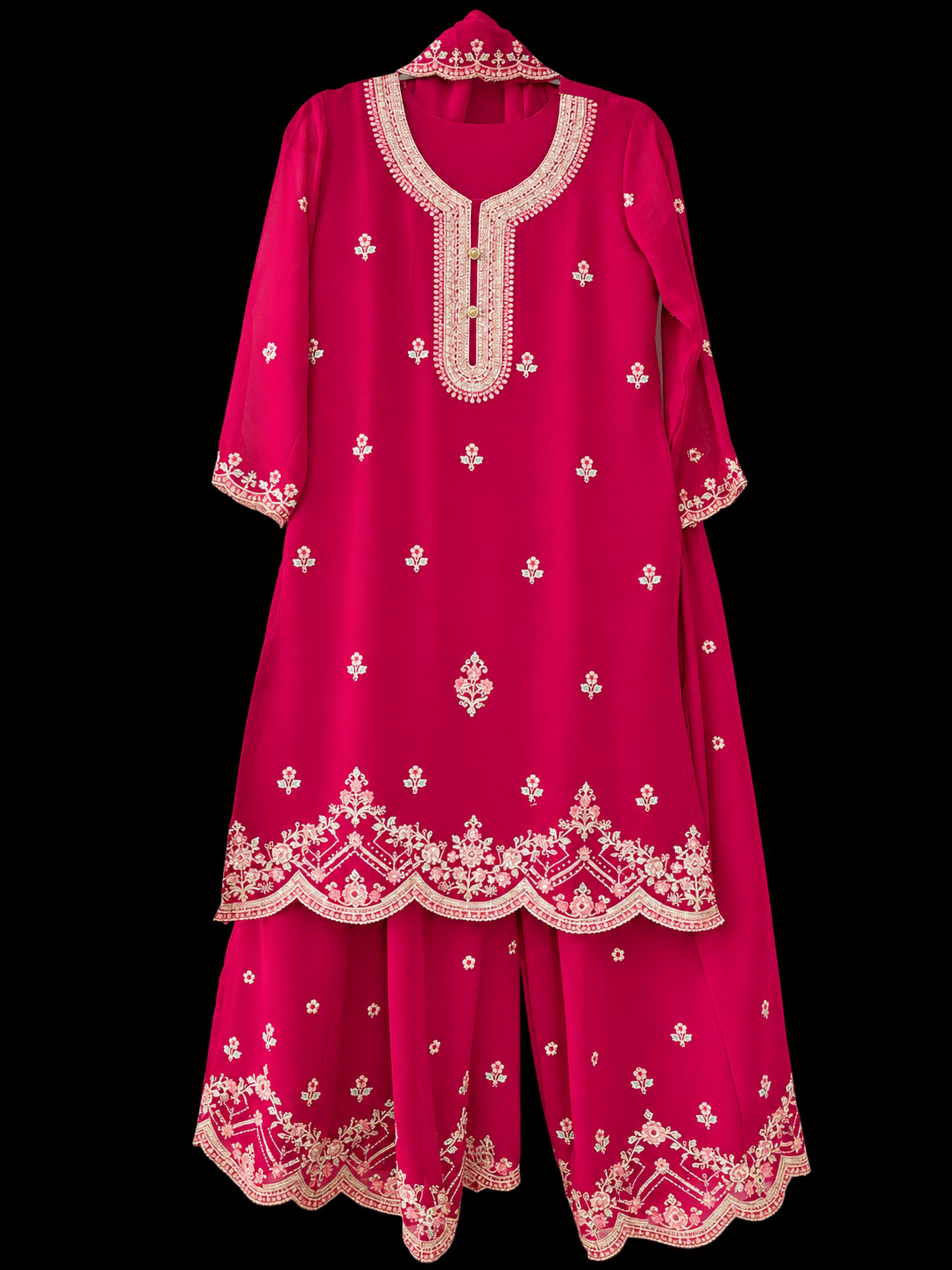 A fuchsia kurta suruwal with pink and green floral embroidery, wide-leg trousers and a sheer dupatta.