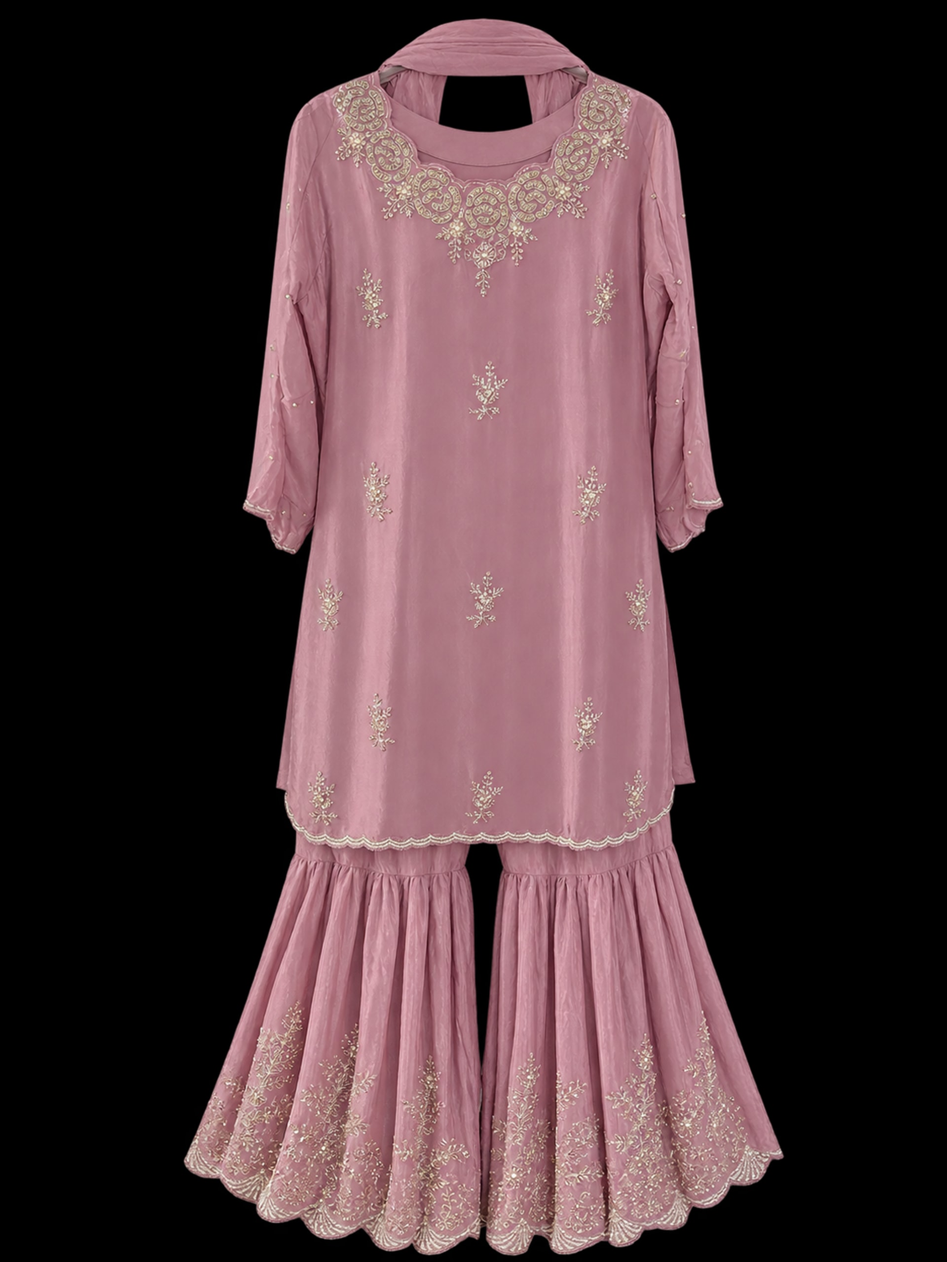 A mauve shimmer kurta with potey beadwork, a broad paisley neckline, flared sharara trousers and a plain dupatta.