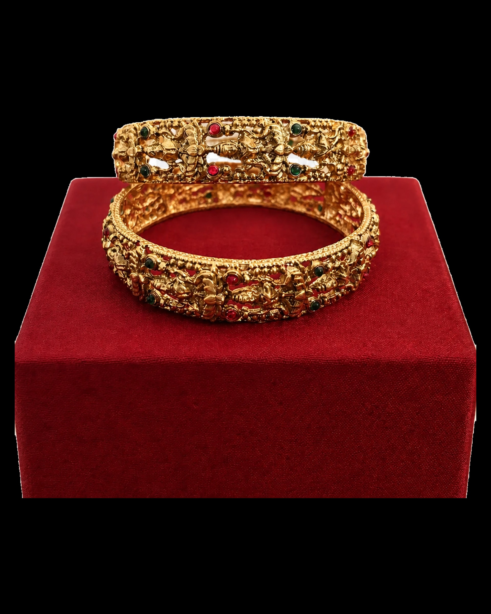 Ornate traditional bangle pair with raised relief and red and green details