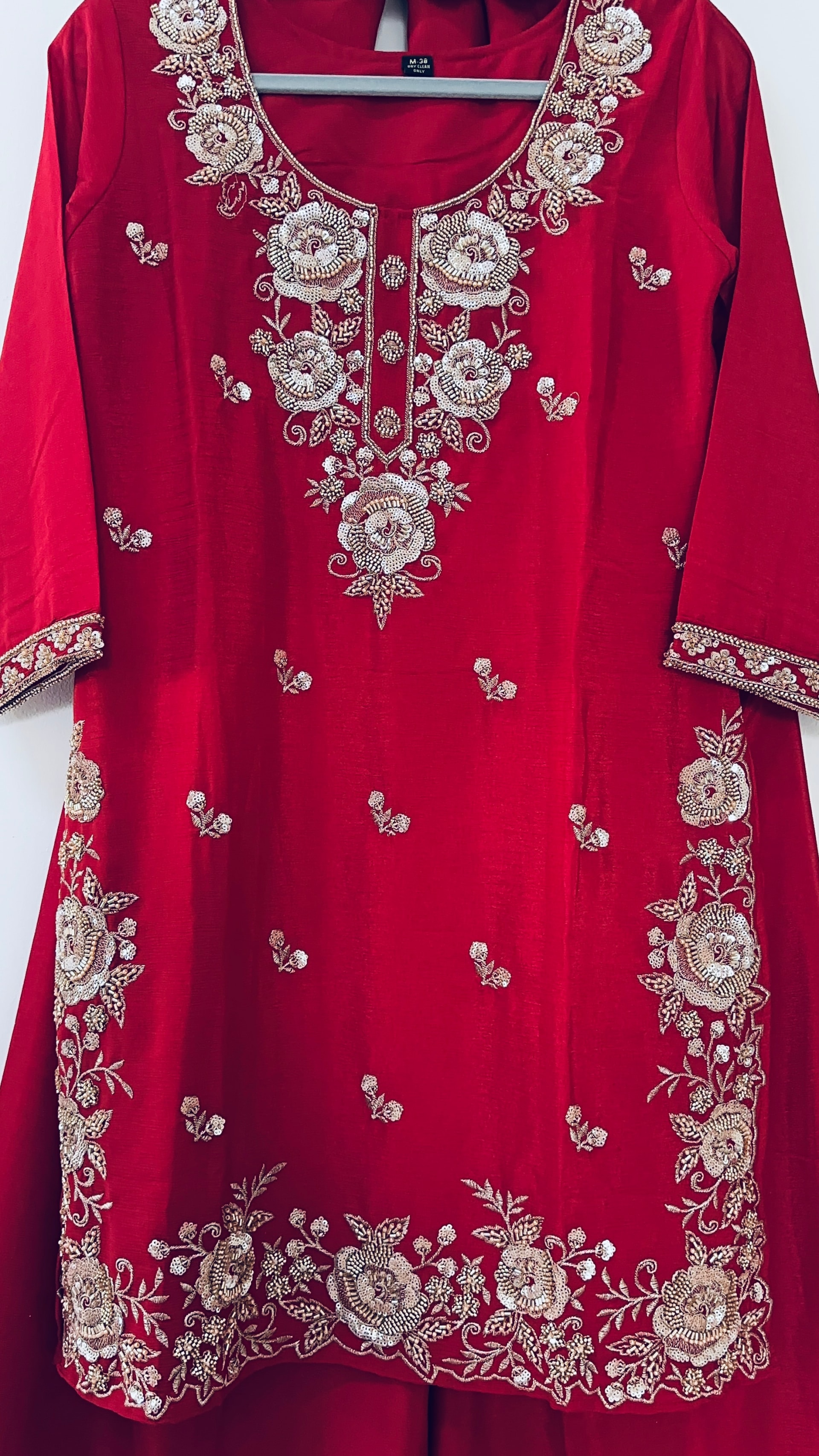 Original crimson red kurta with large circular rose embroidery around the neckline, placket, cuffs and hem