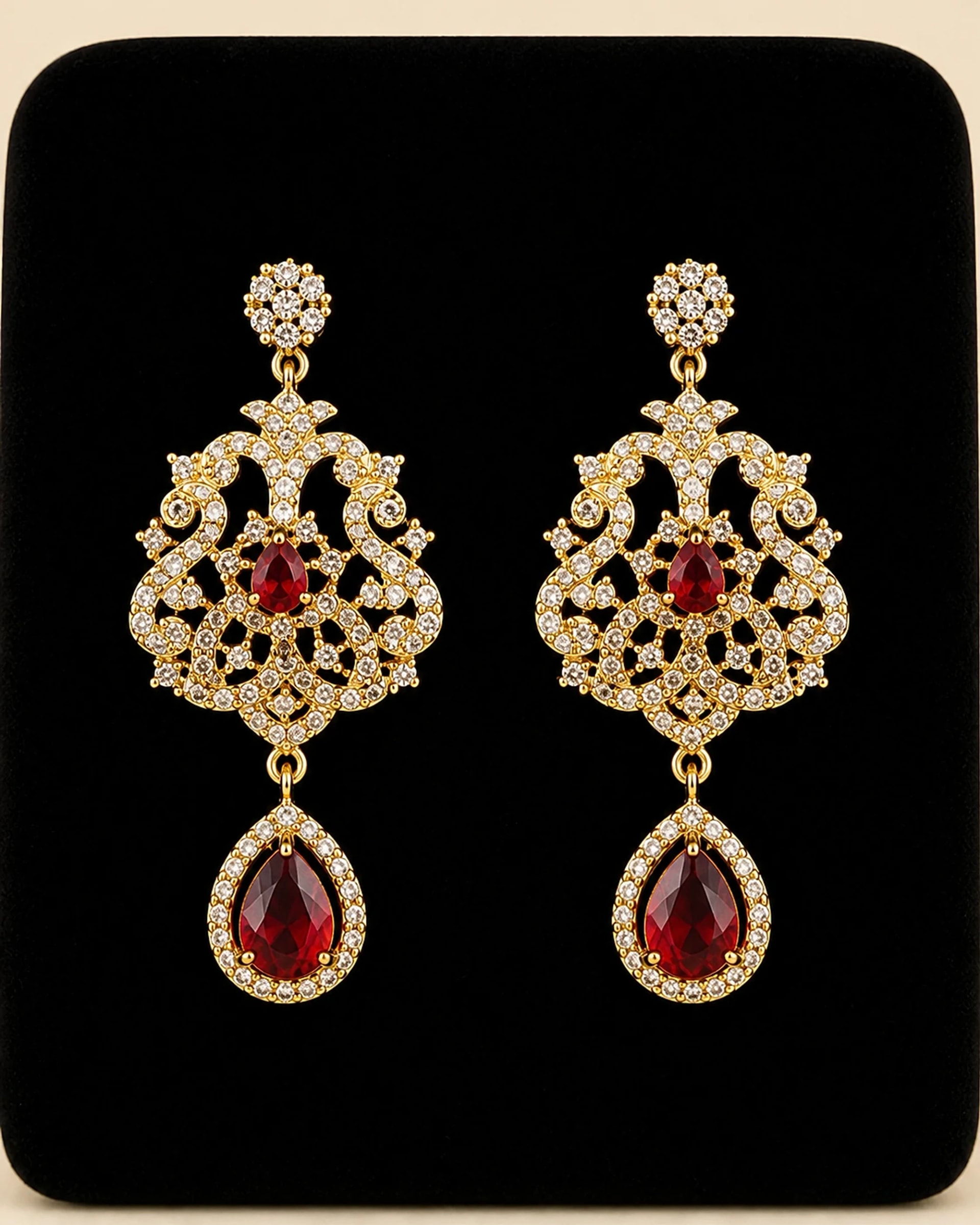 Close detail of the matching crystal and ruby-red earrings