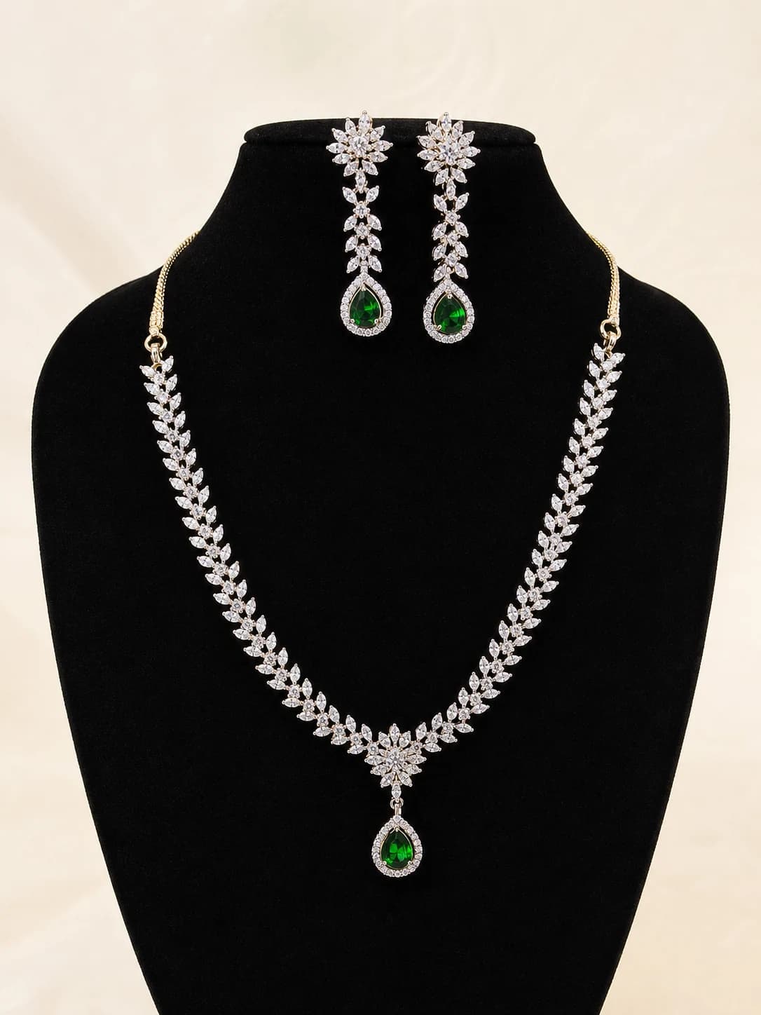 Crystal necklace and matching drop earrings with deep green stones