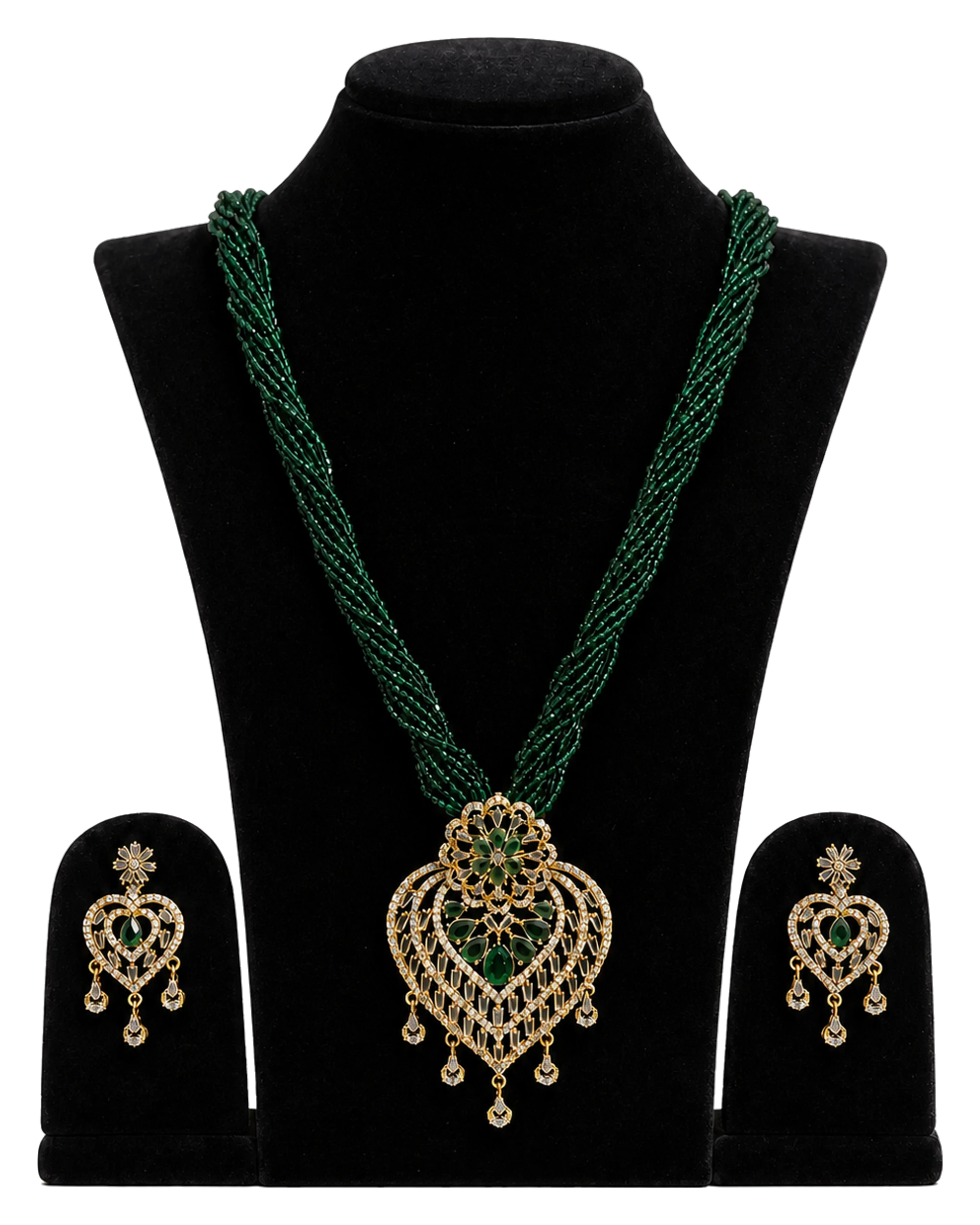 A green potey necklace with several fine bead strands, a decorative pendant and matching earrings.