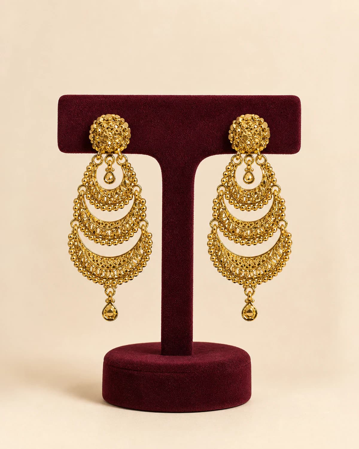 Pair of long statement earrings formed from three textured crescents